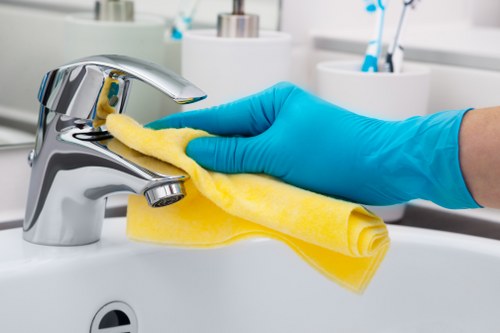 Cleaner following safe handling and reporting procedures